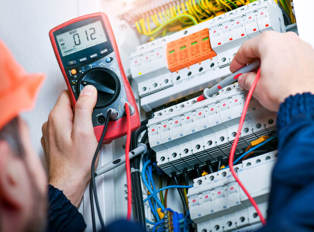 Electrician working with equipment